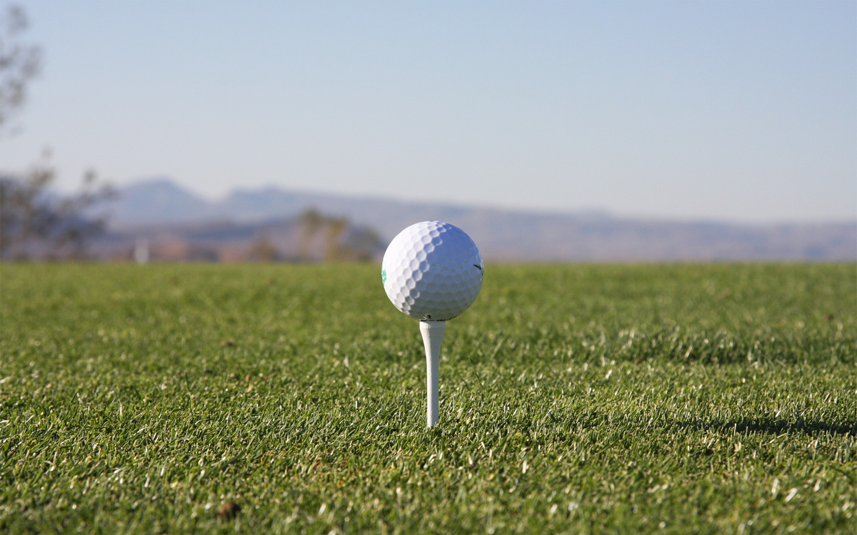 Closeup of a golf ball on a tee