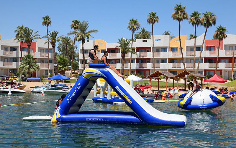 Kids playing on the water slide in the Kid Zone Waterpark.