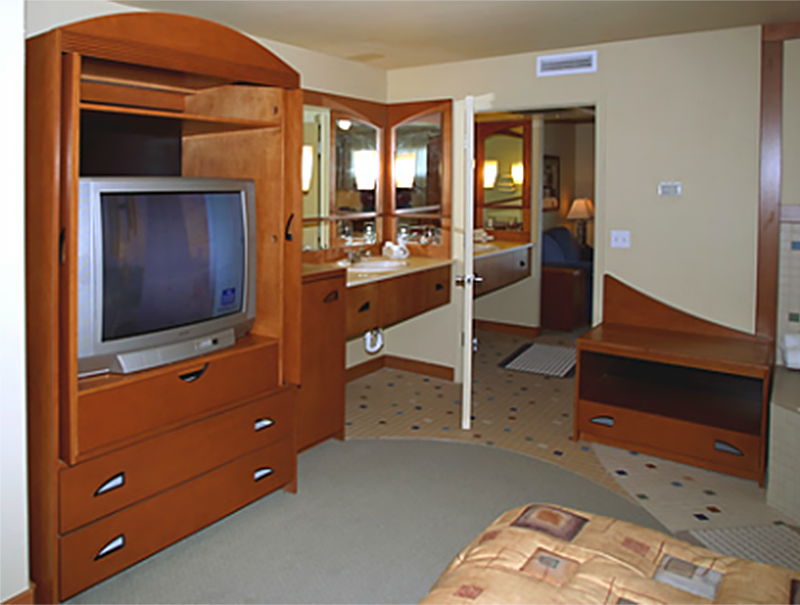 A view of the television in the armoire of the bedroom of a First Cabin Club suite